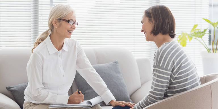 woman comforts woman through addiction treatment resources in virginia beach