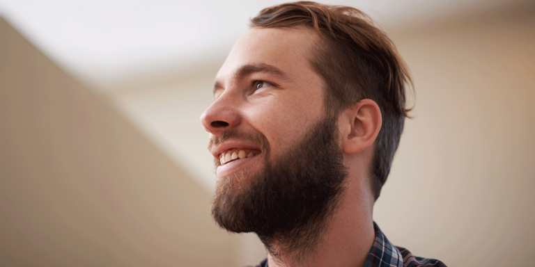 person smiling after starting to notice the benefits of suboxone treatment