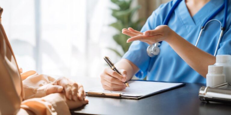 Intake specialist talking to client about how medicaid will pay for suboxone treatment