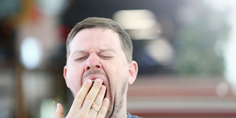 person yawning while experiencing fatigue as one of many common vivitrol side effects