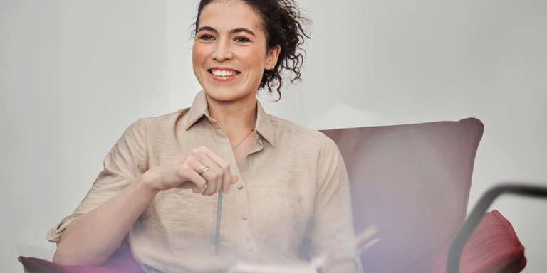 person smiling with book in clinic after finding a mat clinic in louisville, ky