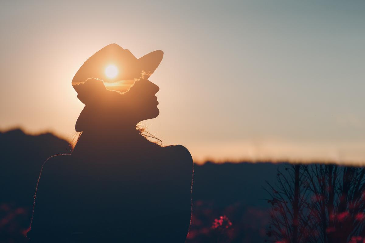 person watching sunset while considering tips to avoid relapse after treatment