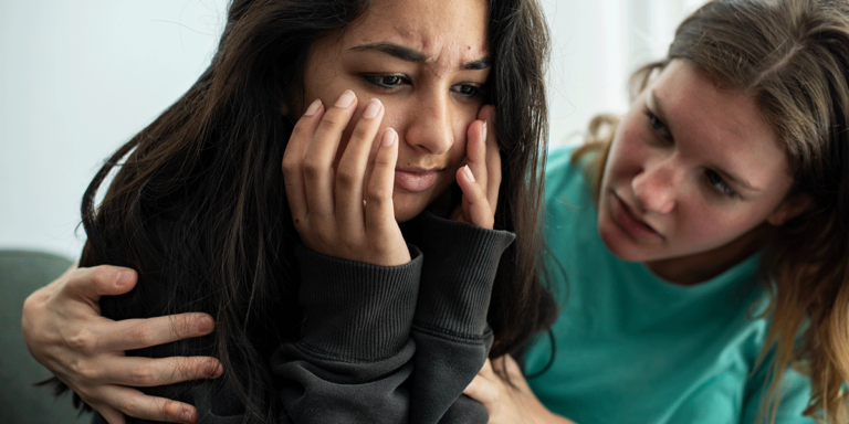 person helping loved one after recognizing signs of drug use in a friend